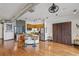 Open concept living room with kitchen featuring stainless steel appliances and hardwood flooring at 5300 Peachtree Rd # 3601, Atlanta, GA 30341