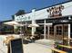 Antiguo Lobo Mexicano & Agave Bar featuring outdoor seating with umbrellas and a welcoming entrance at 5300 Peachtree Rd # 3601, Atlanta, GA 30341