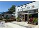 Personify storefront with decorative plants and flowers enhancing the inviting entrance and curb appeal at 5300 Peachtree Rd # 3601, Atlanta, GA 30341