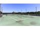 Outdoor tennis court with net and lights at 5300 Peachtree Rd # 3601, Atlanta, GA 30341