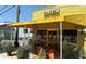Charming Zentea cafe exterior featuring outdoor seating and string lights at 5300 Peachtree Rd # 3601, Atlanta, GA 30341