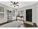 Inviting entryway with dark hardwood floors, natural light, and stylish decor and modern rug at 1076 Firethorne Pass, Cumming, GA 30040