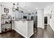 Well-appointed kitchen features stainless steel appliances, sleek countertops, and dark wood floors at 1076 Firethorne Pass, Cumming, GA 30040