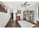 Elegant living room with wood floors, neutral paint, and an antique grandfather clock at 1076 Firethorne Pass, Cumming, GA 30040