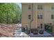Relaxing outdoor patio with comfortable seating and a peaceful natural backdrop at 1076 Firethorne Pass, Cumming, GA 30040