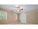 Bedroom featuring carpet, two windows and double door closet at 2795 Autumn Dr, Canton, GA 30115