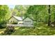 Charming home with a large garage, and well-manicured lawn at 2795 Autumn Dr, Canton, GA 30115