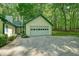 Exterior shot of a two-car garage with an attached apartment or bonus building at 2795 Autumn Dr, Canton, GA 30115