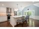 Bright kitchen featuring white cabinets, stainless steel appliances, and a spacious island with bar seating at 2795 Autumn Dr, Canton, GA 30115