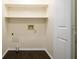 Efficient laundry room with shelving and connections ready for a washer and dryer at 2795 Autumn Dr, Canton, GA 30115