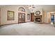 Spacious living room featuring a stone fireplace, vaulted ceilings, and french doors to the exterior at 2795 Autumn Dr, Canton, GA 30115