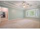 The main bedroom offers a cozy retreat with large windows and views of the backyard at 2795 Autumn Dr, Canton, GA 30115