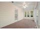 Bright sunroom with wall-to-wall carpeting, windows and access to exterior at 2795 Autumn Dr, Canton, GA 30115
