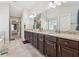 Spacious bathroom with double vanity, granite countertops, and tile flooring at 4050 Danbury Farms Dr, Cumming, GA 30040