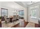 Bright dining room featuring a chandelier, table with seating for six, and natural light from windows at 4050 Danbury Farms Dr, Cumming, GA 30040