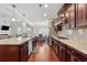 Spacious kitchen with a large island, modern appliances, and seamless access to dining and living areas at 4050 Danbury Farms Dr, Cumming, GA 30040