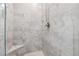 Beautifully tiled shower with a built-in seat and sleek fixtures at 4050 Danbury Farms Dr, Cumming, GA 30040