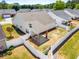 Aerial view of the backyard with a covered patio and white fencing at 806 Village Pl, Loganville, GA 30052