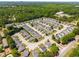 Aerial view of a well-planned community surrounded by lush trees and easy access roads at 806 Village Pl, Loganville, GA 30052