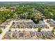 A high angle view shows the layout of the neighborhood and surrounding trees and streets at 806 Village Pl, Loganville, GA 30052