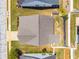 Aerial view of home and landscaped yard showing a well maintained roof and green lawn at 806 Village Pl, Loganville, GA 30052