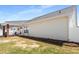 Spacious backyard showcasing the covered patio with fan at 806 Village Pl, Loganville, GA 30052