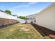Backyard with a covered patio and white fencing at 806 Village Pl, Loganville, GA 30052