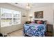 Inviting bedroom featuring a large window that bathes the room in natural light, creating a cozy and relaxing atmosphere at 806 Village Pl, Loganville, GA 30052