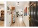 Inviting entryway featuring hardwood floors, a display cabinet, and views into the living room at 806 Village Pl, Loganville, GA 30052