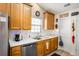 Well-lit kitchen featuring stainless steel appliances, ample cabinet space, and neutral countertops for a clean and functional design at 806 Village Pl, Loganville, GA 30052