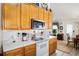 Bright kitchen with stainless steel microwave, white appliances, and plenty of counter space for meal prep and entertaining at 806 Village Pl, Loganville, GA 30052