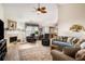 Cozy living room with vaulted ceilings, a fireplace, and ample natural light at 806 Village Pl, Loganville, GA 30052
