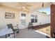 Covered back patio with ceiling fan, offering a cozy outdoor living space at 806 Village Pl, Loganville, GA 30052