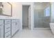 Well-lit bathroom featuring double vanities, a glass shower, and a soaking tub at 113 Iveybrooke Ln # 61, Alpharetta, GA 30009
