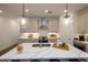 Open concept kitchen with stainless steel appliances, kitchen island, and modern lighting at 113 Iveybrooke Ln # 61, Alpharetta, GA 30009
