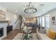 Open concept living space features a staircase, dining area, and open access to the kitchen at 113 Iveybrooke Ln # 61, Alpharetta, GA 30009