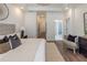 Bright main bedroom with hard surface floors leading to the main bath at 113 Iveybrooke Ln # 61, Alpharetta, GA 30009
