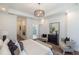 Bright main bedroom with hard surface floors and sitting area leading to the main bath at 113 Iveybrooke Ln # 61, Alpharetta, GA 30009