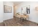 Bright office space with stylish desk, wood floors, and modern art at 113 Iveybrooke Ln # 61, Alpharetta, GA 30009