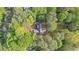 A secluded home surrounded by lush trees, offering a private and tranquil setting at 130 Laguna Springs Dr, Woodstock, GA 30188