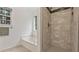 Bright white bathroom with a tiled shower, tub, and neutral flooring for a modern look at 130 Laguna Springs Dr, Woodstock, GA 30188
