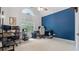 Spacious bedroom with a vaulted ceiling, oversized window and a bold blue accent wall at 130 Laguna Springs Dr, Woodstock, GA 30188