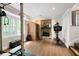 Basement featuring a sauna, stone fireplace, workout equipment, and vinyl floors at 247 Shallowford Nw Rd, Kennesaw, GA 30144