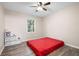 Simple bedroom design with modern vinyl floors and a full bed at 247 Shallowford Nw Rd, Kennesaw, GA 30144