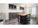 Modern Kitchen featuring a movable island, sleek cabinets, stainless steel appliances, and natural light at 247 Shallowford Nw Rd, Kennesaw, GA 30144