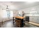 Bright kitchen with white cabinets, butcher block island, and stainless-steel appliances at 247 Shallowford Nw Rd, Kennesaw, GA 30144