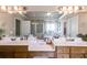 Bathroom featuring double vanity sinks and a large decorative mirror at 4828 Planters Walk, Douglasville, GA 30135