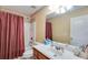 Bathroom with shower and tub, decorative border, toilet, large mirror and vanity sink at 4828 Planters Walk, Douglasville, GA 30135