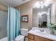 Cozy bathroom offers a tub/shower combo and wooden vanity with sink at 4828 Planters Walk, Douglasville, GA 30135