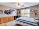 This car-themed bedroom features race car decor, wooden furniture, and ceiling fan at 4828 Planters Walk, Douglasville, GA 30135